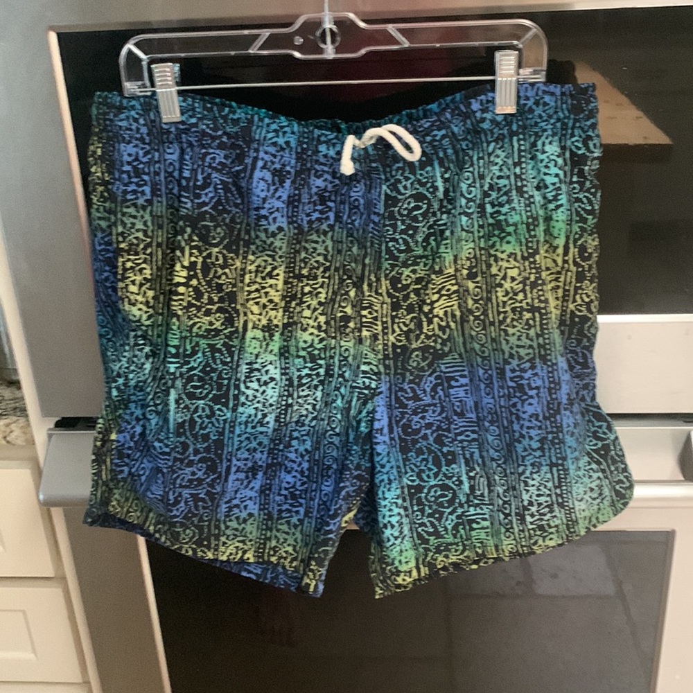 Gitano size large swimsuit with side pockets.